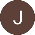 Brown circle with white letter J inside.